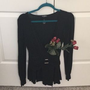 Low cut black top with silver buckle.